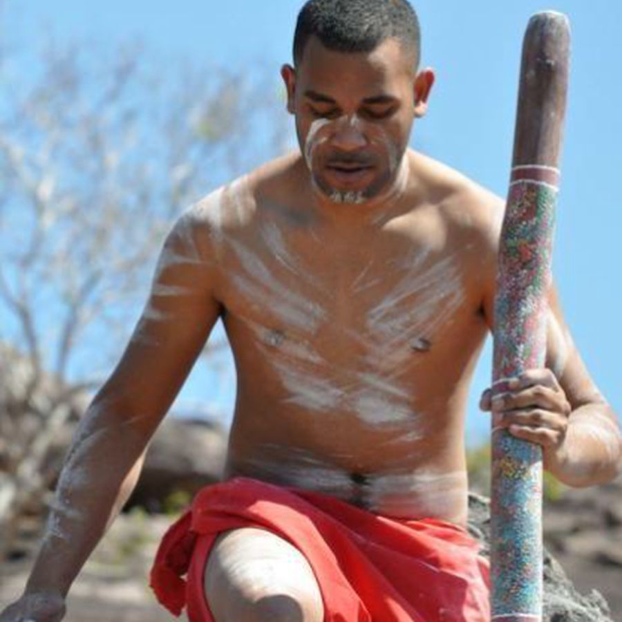 Ryka Ali seated with a painted clapstick